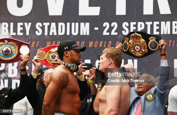 Anthony Joshua And Alexander Povetkin face off after the Anthony Joshua And Alexander Povetkin weigh in on September 21, 2018 in London, England.