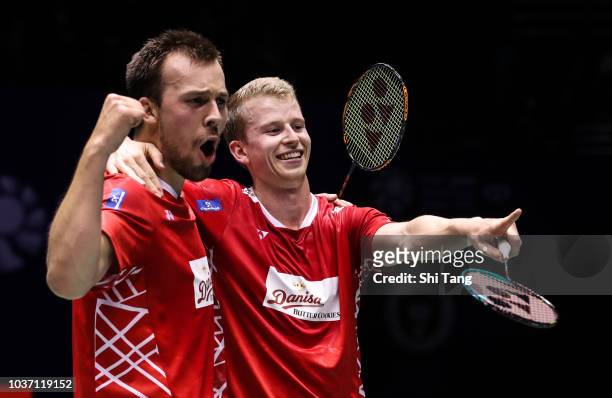 Kim Astrup and Anders Skaarup Rasmussen of Denmark celebrate the victory after their Men's Doubles quarter finals match against Liu Yuchen and Li...