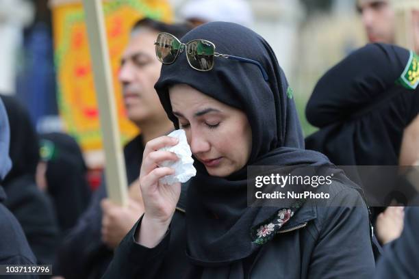 Woman crying as Shiite Muslim mourners take part in a Muharram procession in Toronto, Ontario, Canada, on September 20, 2018. Hundreds of Shiite...