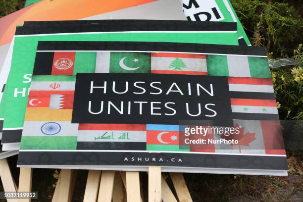 'Hussain Unites Us' sign as Shiite Muslim mourners take part in a Muharram procession in Toronto, Ontario, Canada, on September 20, 2018. Hundreds of...