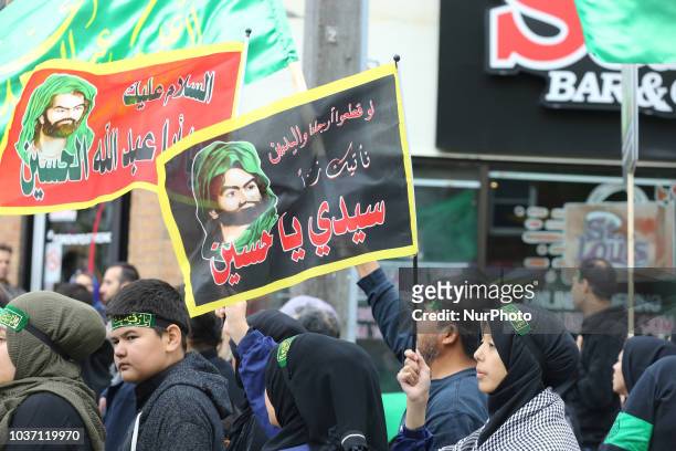 Shiite Muslim mourners take part in a Muharram procession in Toronto, Ontario, Canada, on September 20, 2018. Hundreds of Shiite Muslims took to the...