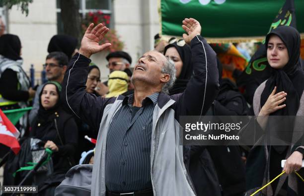 Man becomes emotional and beats his chest as Shiite Muslim mourners take part in a Muharram procession in Toronto, Ontario, Canada, on September 20,...
