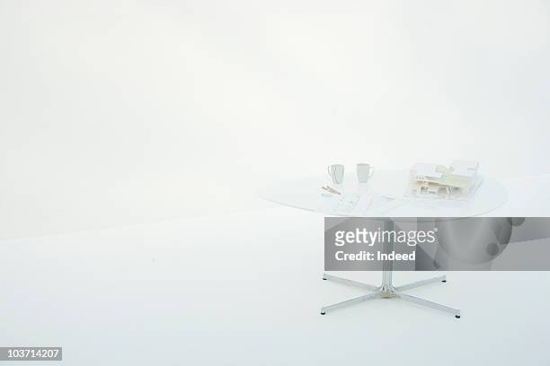 architectural model with blueprint on the table - architekturmodell stock-fotos und bilder