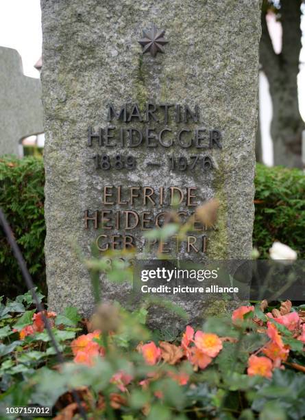 Flowers decorate the grave and tombstone of German philosopher Martin Heidegger at the cemetery in Messkirch, Germany, 22 September 2014. Heidegger...