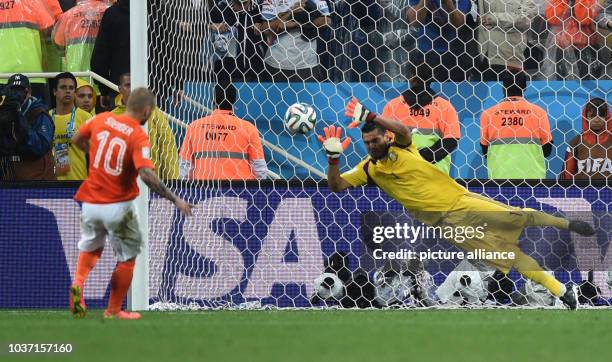 Goalkeeper Sergio Romero of Argentina saves the penalty of Dutch Wesley Sneijder during the penalty shoot-out of the FIFA World Cup 2014 semi-final...