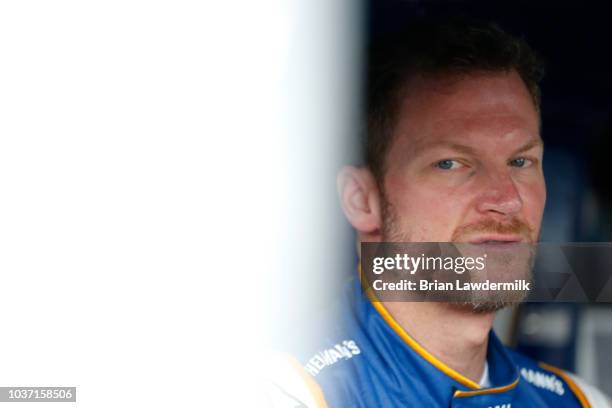 Dale Earnhardt Jr, driver of the Hellmann's Camaro Chevrolet, stands on the grid during practice for the NASCAR Xfinity Series GoBowling 250 at...