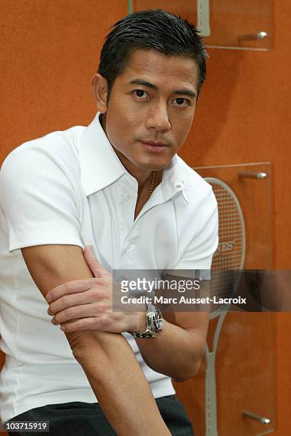 Chinese actor Aaron Kwok poses in the 'Village', the VIP area of the French Open at Roland Garros arena in Paris, France on June 1, 2007.