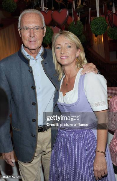 Football legend Franz Beckenbauer and his wife Heidrun pose at the get-together of the Bavarian evening in the context of the 29th Kaiser Cup golf...