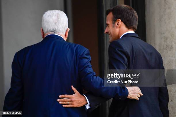 French President Emmanuel Macron welcomes Palestinian president Mahmud Abbas prior to their meeting at the Elysee Palace, on September 21, 2018 in...
