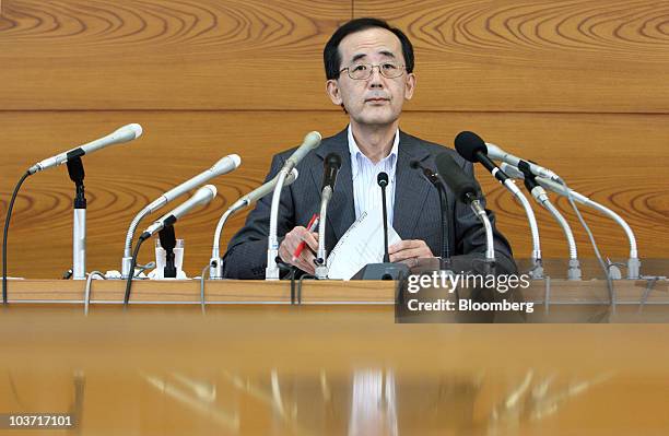 Masaaki Shirakawa, governor of the Bank of Japan, speaks during a news conference after an emergency board meeting at the central bank's headquarters...