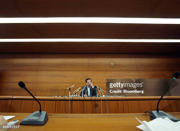 Masaaki Shirakawa, governor of the Bank of Japan, attends a news conference after an emergency board meeting at the central bank's headquarters in...