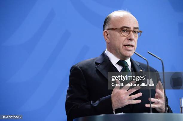 French Prime Minister Bernard Cazeneuve speaks during a joint press conference with German Chancellor Merkel in Berlin, Germany, 13 February 2017....