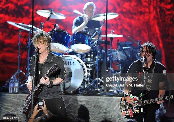 Lead singer John Rzeznik, drummer Mike Malinin and bassist Robby Takac of the Goo Goo Dolls perform at the Greek Theater on August 29, 2010 in Los...