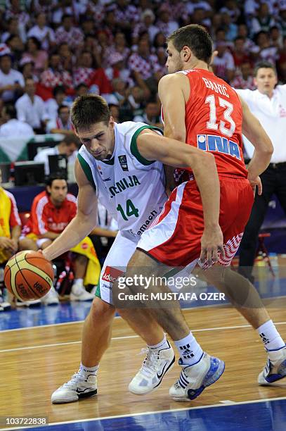 Gasper Vidmar of Slovenia vies with Marko Banic of Croatia during the preliminary round group B match between Slovenia and Croatia, at the FIBA World...