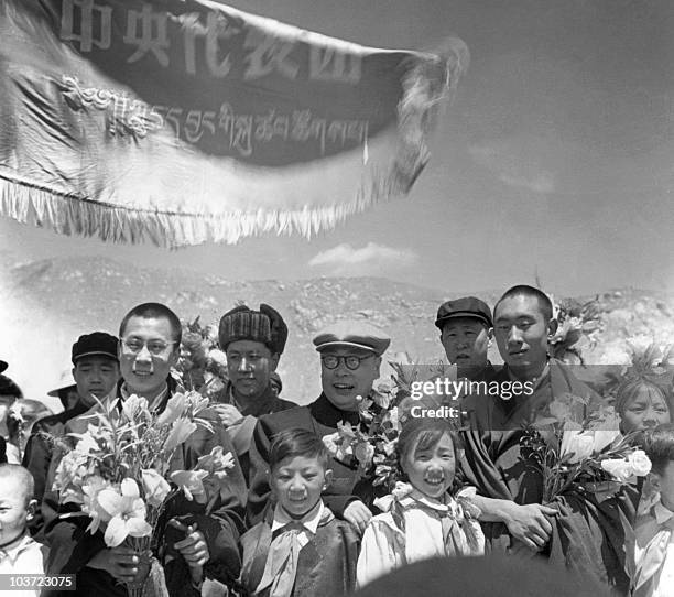Panchen Lama, Chinese Vice-Premier Chen Yi, and Dalai Lama, surrounded by young pioneers 17 April 1956 in Lhasa, the capital of Tibet during the...