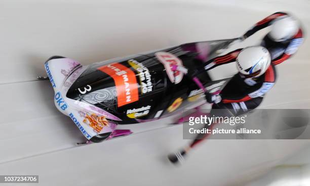 German bobbers Sandra Kiriasis and her brakewoman Berit Wiacker start a run at the women's two-person bobsleigh world cup at the artificial ice track...