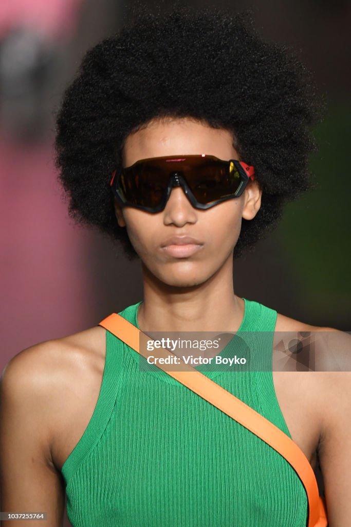 A model, sunglasses detail, walks the runway at the MSGM show during ...