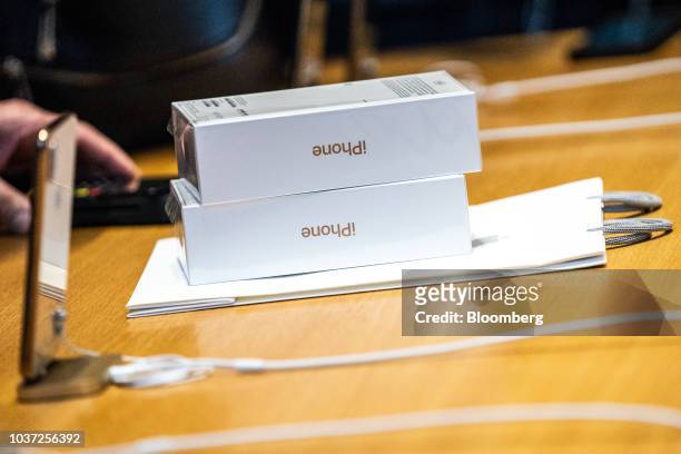 Apple Inc. IPhone XS boxes sit on a counter during a sales launch at a store in New York, U.S., on Friday, Sep. 21, 2018. The iPhone XS is up to $200...