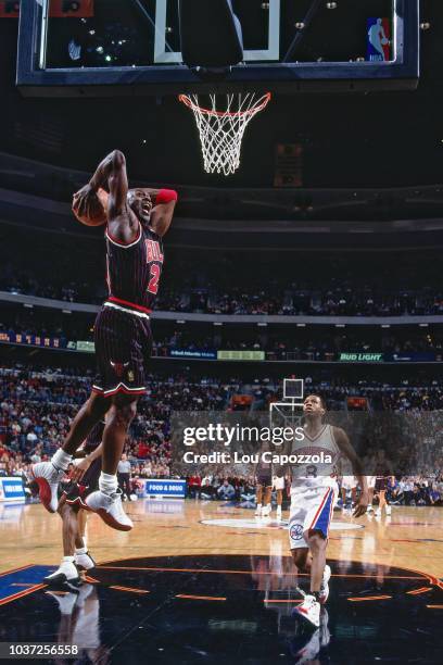 Michael Jordan of the Chicago Bulls dunks against the Philadelphia 76ers on December 21, 1996 at the CoreStates Center in Philadelphia, Pennsylvania....