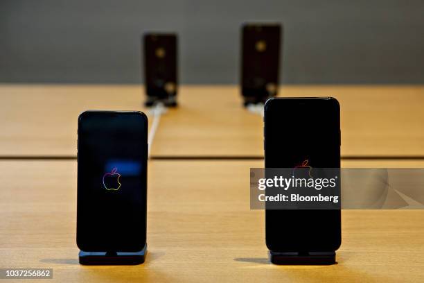 An Apple Inc. IPhone XS, left, and iPhone XS Max smartphones sit on display during a sales launch at a store in Chicago, Illinois, U.S., on Friday,...