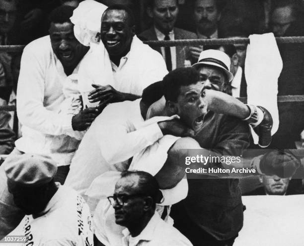 Cassius Clay flies around the ring after beating Sonny Liston in the seventh round of the World Heavyweight Title bout in Miami Beach, Florida, USA....