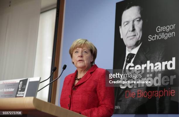 German Chancellor Angela Merkel speaks during the presentation of the new biography on her predecessor Gerhard Schroeder in Berlin, Germany, 22...