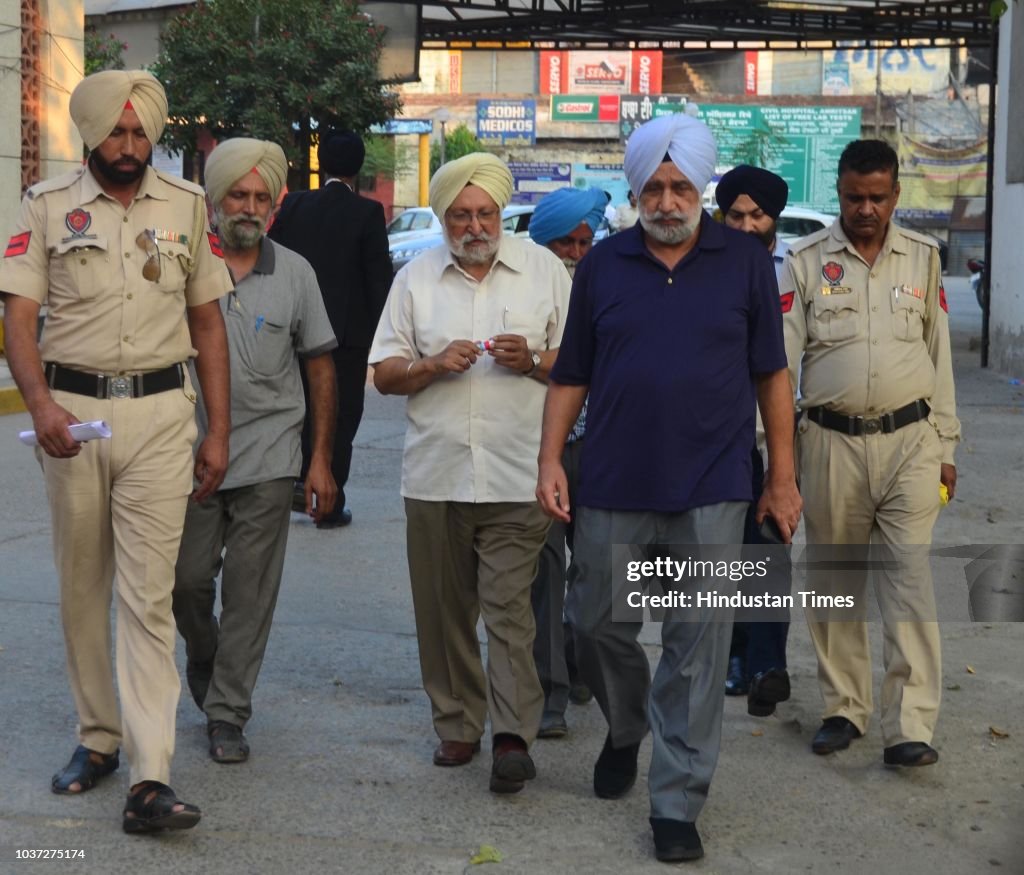 Police personnel take Chief Khalsa Diwan president Dr Santokh Singh