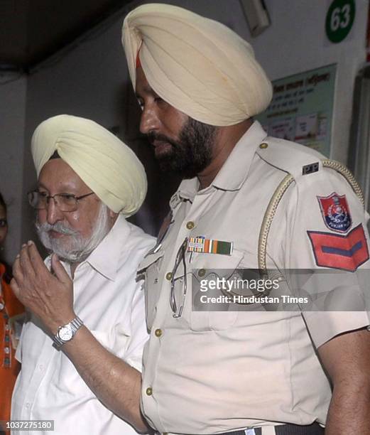 Police personnel take Chief Khalsa Diwan president Dr Santokh Singh to Central Jail Amritsar after he was sentenced to five year imprisonment and...