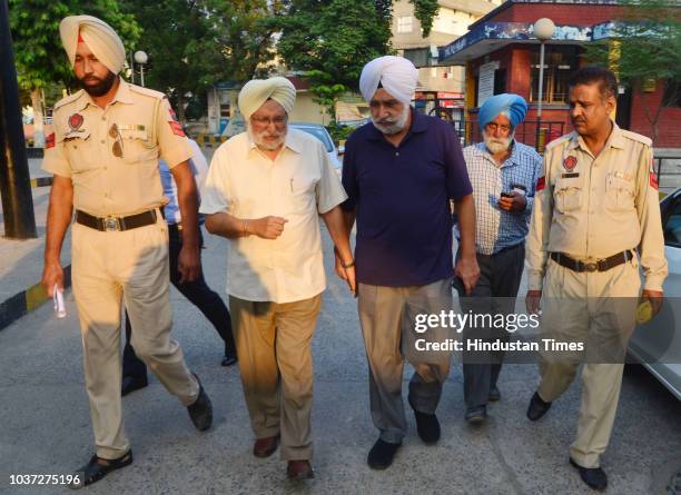 Police personnel take Chief Khalsa Diwan president Dr Santokh Singh to Central Jail Amritsar after he was sentenced to five year imprisonment and...