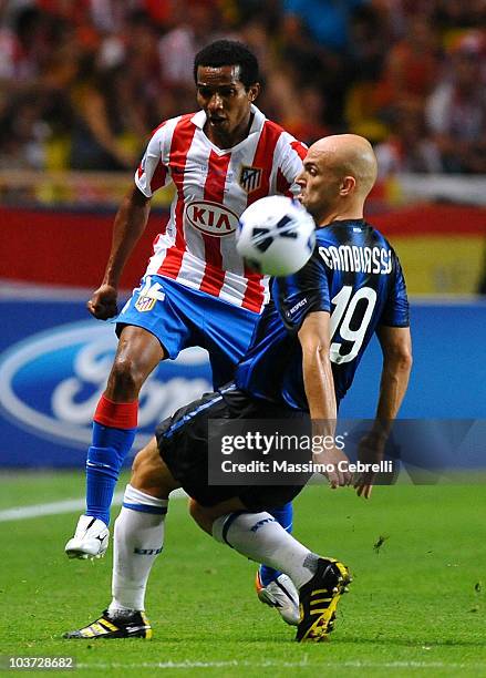 Esteban Cambiasso of FC Inter Milan battles for the ball against Paulo Assuncao of Atletico de Madrid during the UEFA Super Cup match between FC...