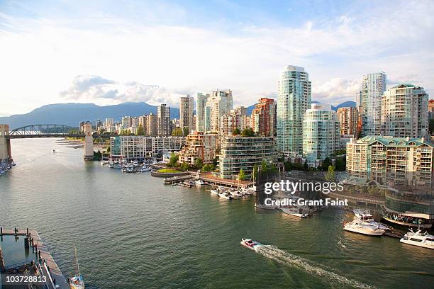 high view of urban buildings near ocean - vancouver stock pictures, royalty-free photos & images