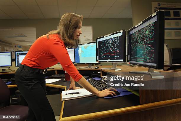 Meteorologist Jessica Schauer works on tracking Hurricane Earl at the National Hurricane Center on August 30, 2010 in Miami, Florida. Jessica said...