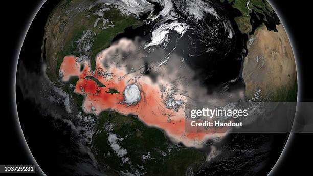 In this handout satellite image provided by the National Oceanic and Atmospheric Administration , warm ocean temperatures intensify the strength of...