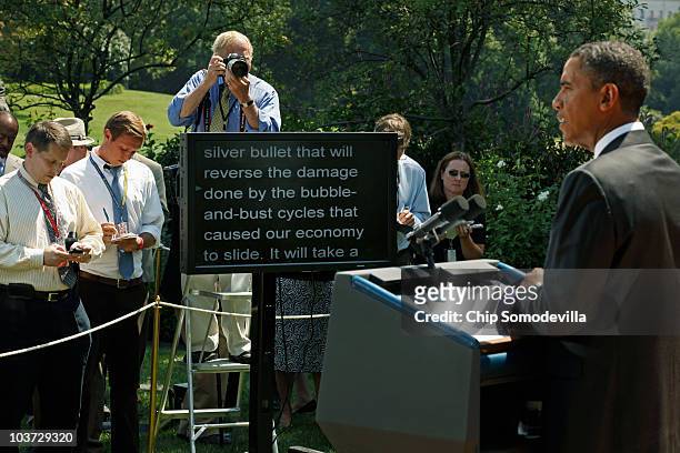 President Barack Obama delivers remarks from a teleprompter to the press after his daily economic briefing in the Rose Garden at the White House...