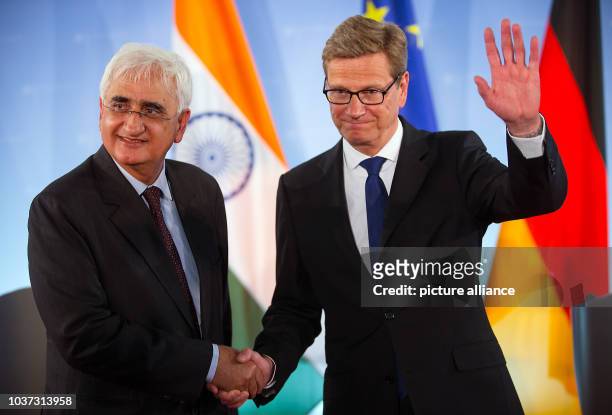 German Foreign Minister Guido Westerwelle and his Indian colleague Salman Khurshid shake hands after a press conference at the Foreign Office in...