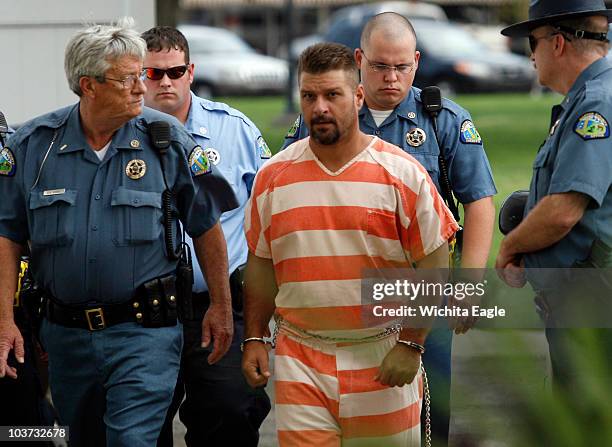 Adam Longoria is led into the Barton County District Court in Great Bend, Kansas, Monday, August 30, 2010. Longoria, a "person of interest" in...