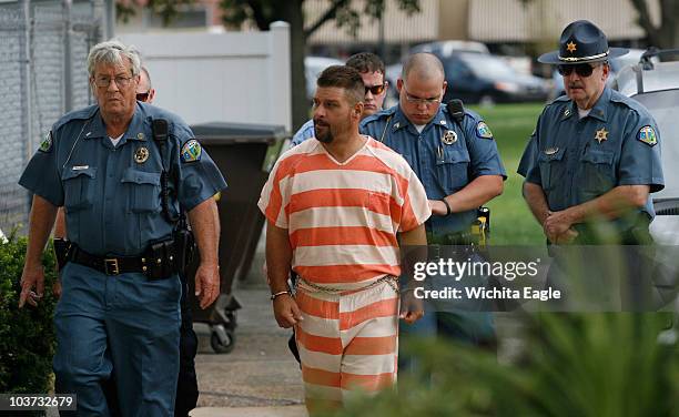 Adam Longoria is led into the Barton County District Court in Great Bend, Kansas, Monday, August 30, 2010. Longoria, a "person of interest" in...