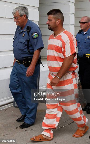 Adam Longoria is led into the Barton County District Court in Great Bend, Kansas, Monday, August 30, 2010. Longoria, a "person of interest" in...