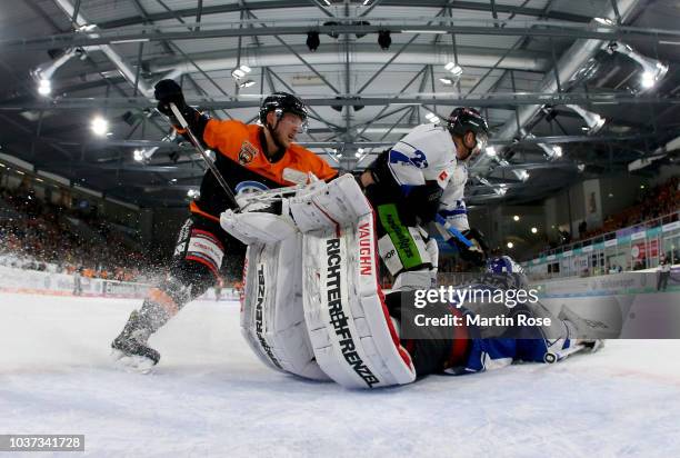 Nick Latta of Wolfsburg fails to score over Jeff Zatkoff, goaltender of Straubing during the DEL match between Grizzlys Wolfsburg and Straubing...