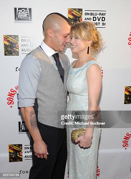 Actor Theo Rossi and actress Sarah Jones arrive at the premiere premiere of FX and FOX 21's "Sons Of Anarchy" Season 3 at the Arclight Theatre on...