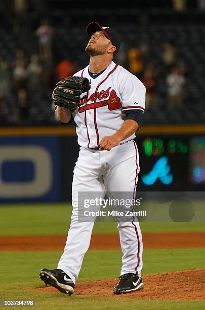 Closer Billy Wagner of the Atlanta Braves looks towards the sky after the last out in the the game against the New York Mets at Turner Field on...