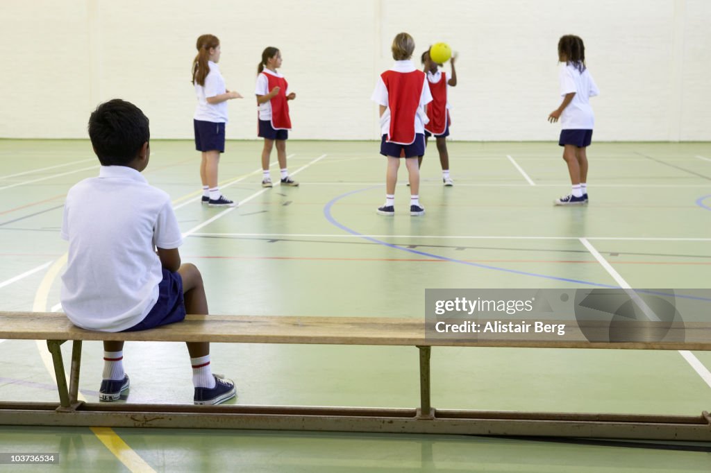 Children exercising in gymnasium