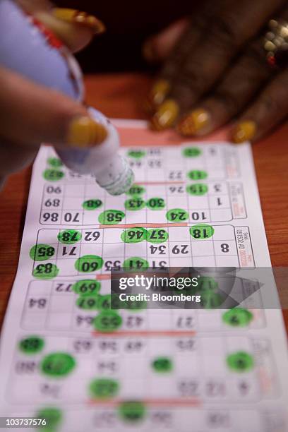 Player marks her bingo card during a game at a Gala Bingo club, operated by Gala Coral Group Ltd., in London, U.K., on Thursday, Aug. 26, 2010. Gala...