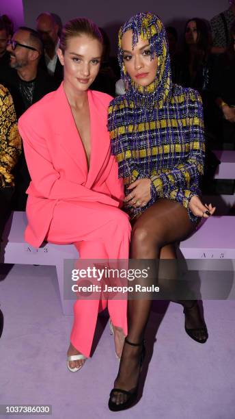 Rosie Huntington-Whiteley and Rita Ora arrive at the Versace show during Milan Fashion Week Spring/Summer 2019 on September 21, 2018 in Milan, Italy.