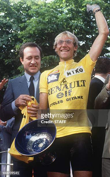 Picture taken on July 24, 1983 in Paris shows French Laurent Fignon on the podium next to Jean Tiberi, assistant mayor of Paris, after winning the...
