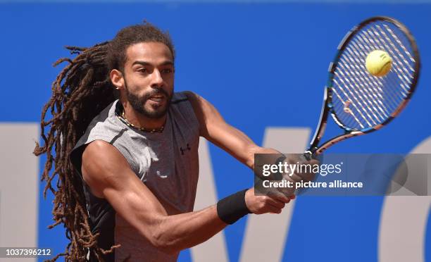 German tennis player Dustin Brown in action against Zverev in the men's singles match at the ATP tour in Munich, Germany, 02 May 2017. Photo:...