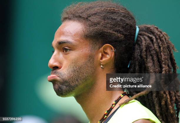 German tennis player Dustin Brown reacts to the loss of a point during the match against Russian tennis player Kuznetsov at the ATP tournament in...