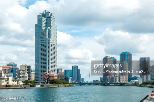 tokyo cityscapers with skyscrapers office and residential buildings, chuo bridge at day time, chuo ward, tokyo, japan. - tsukishima tokio stockfoto's en -beelden