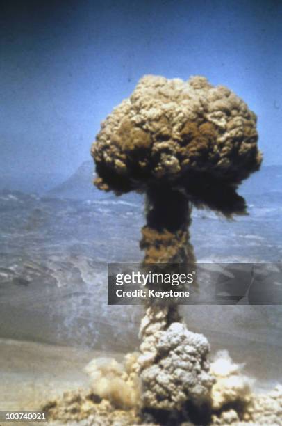 Mushroom cloud reaches high into the sky during atomic testing in Nevada, USA, circa 1940.