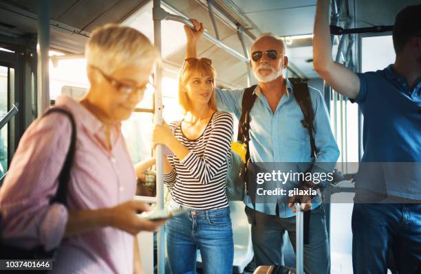 public bus ride. - man riding bus stock pictures, royalty-free photos & images